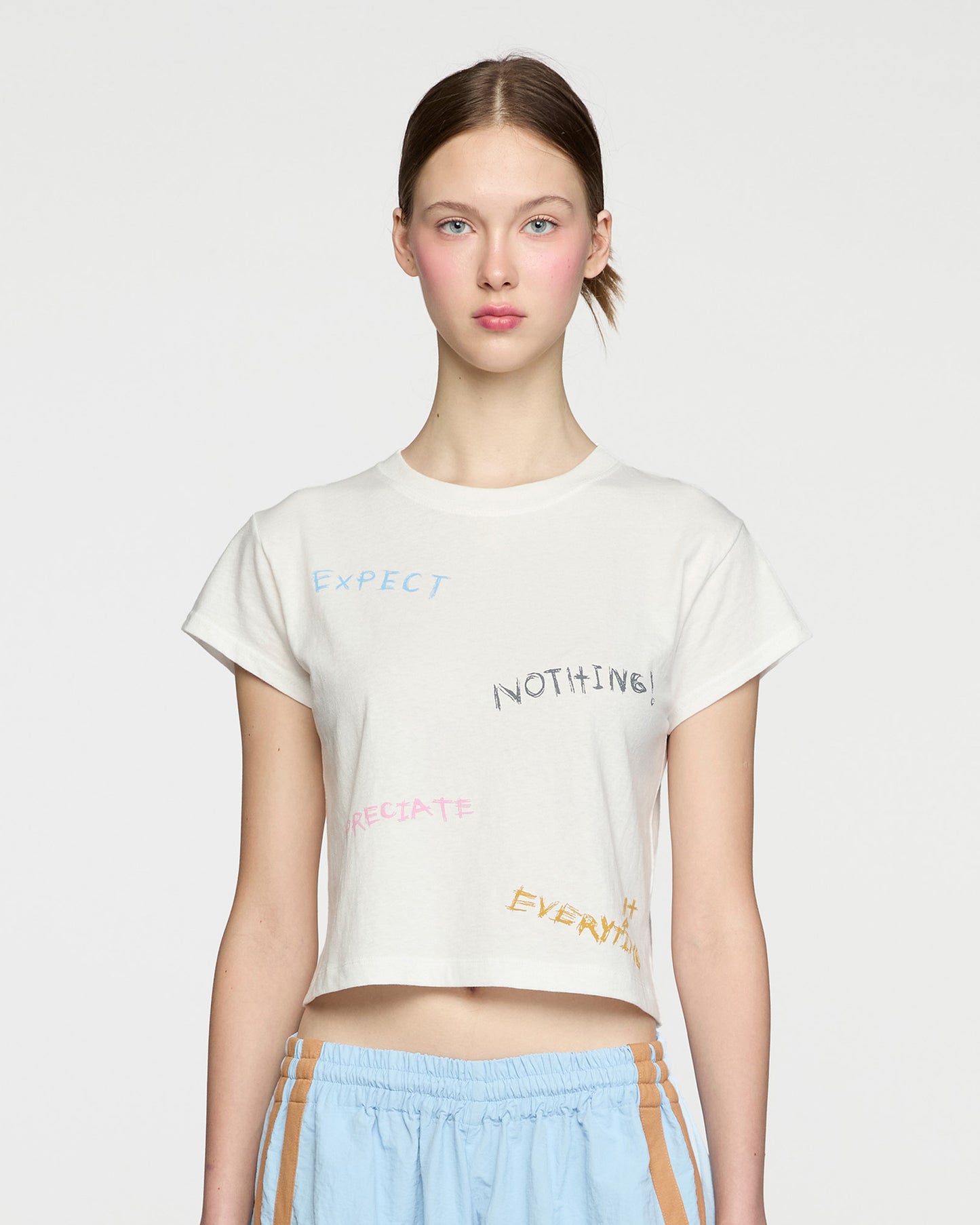 EXPECT NOTHING BABY TEE